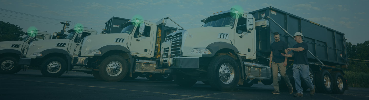 Truck Drivers Walking in Front of Trucks